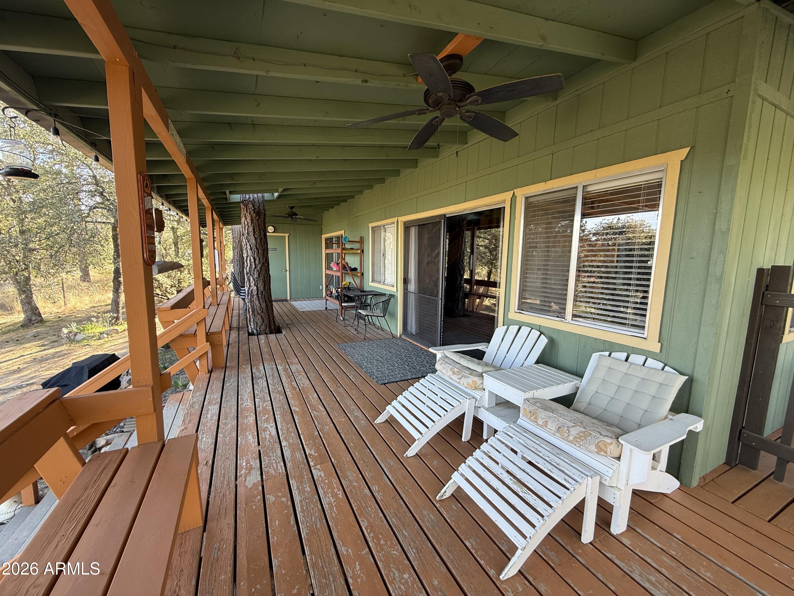 23487 Manzanita Road Crown King, AZ 86343 - Photo 24 of 45 a outdoor space with wooden floor and furniture