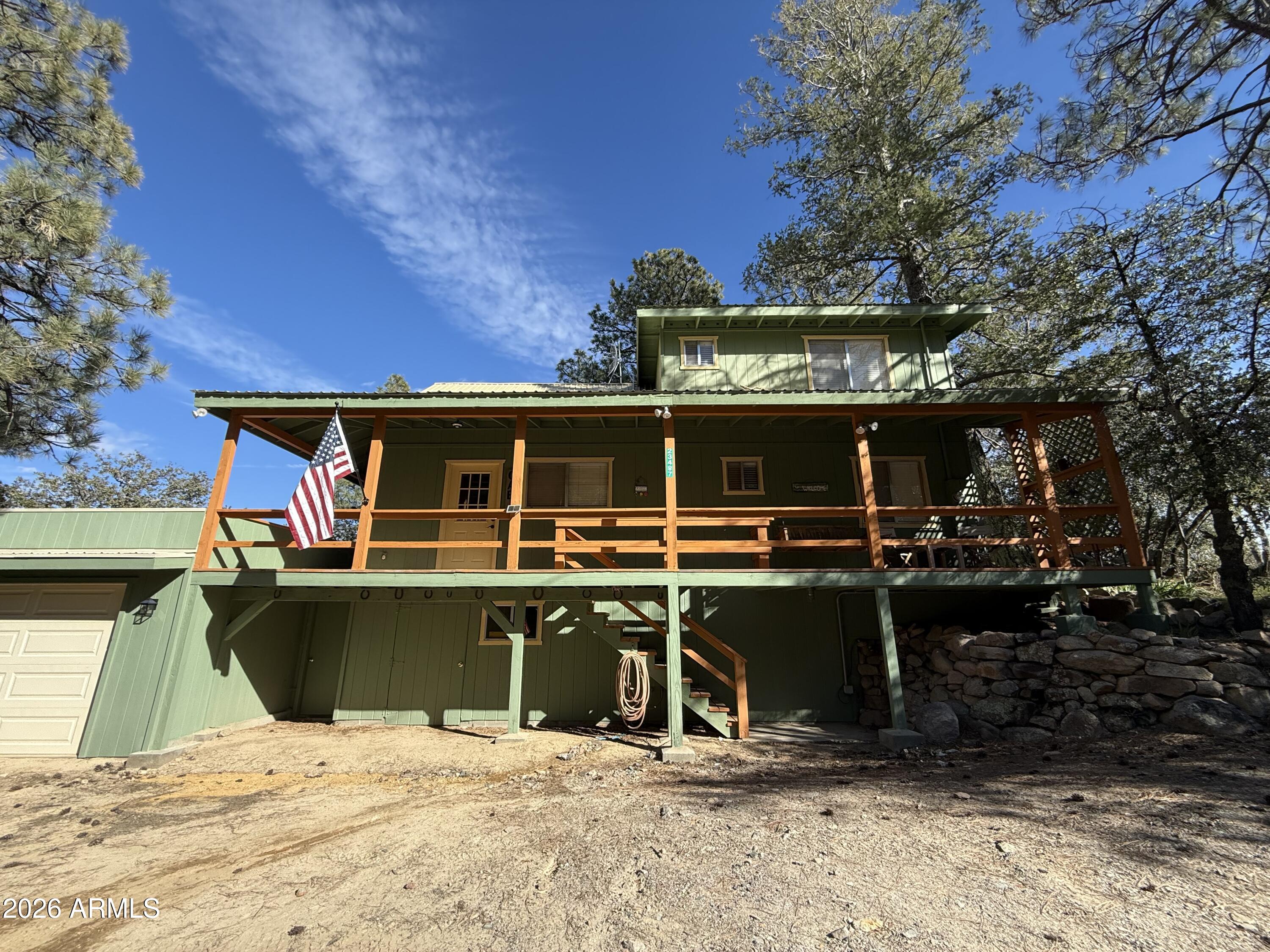 23487 Manzanita Road Crown King, AZ 86343 - Photo 27 of 45 a view of a house with a patio