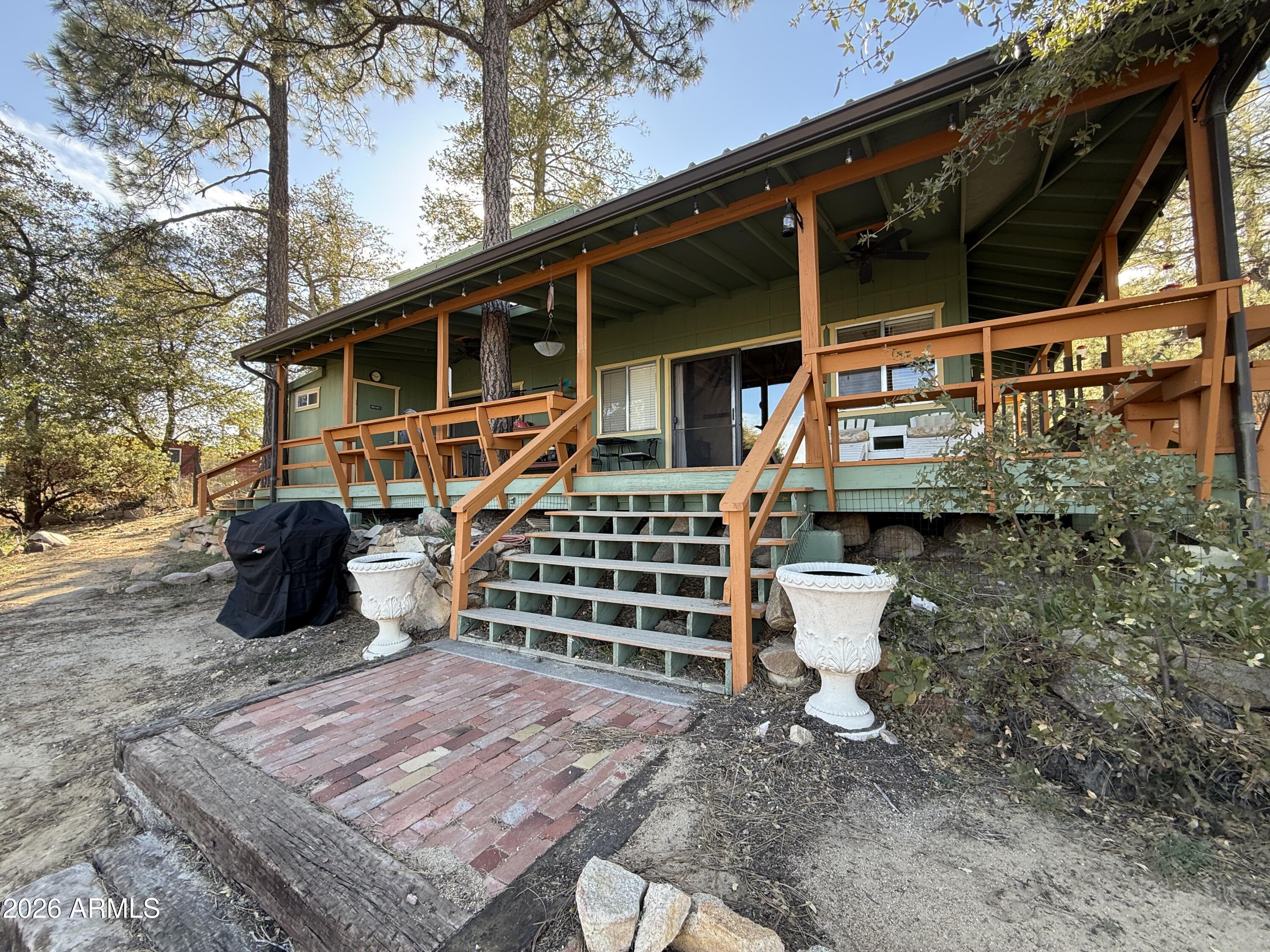 23487 Manzanita Road Crown King, AZ 86343 - Photo 27 of 41 a front view of a house with a yard