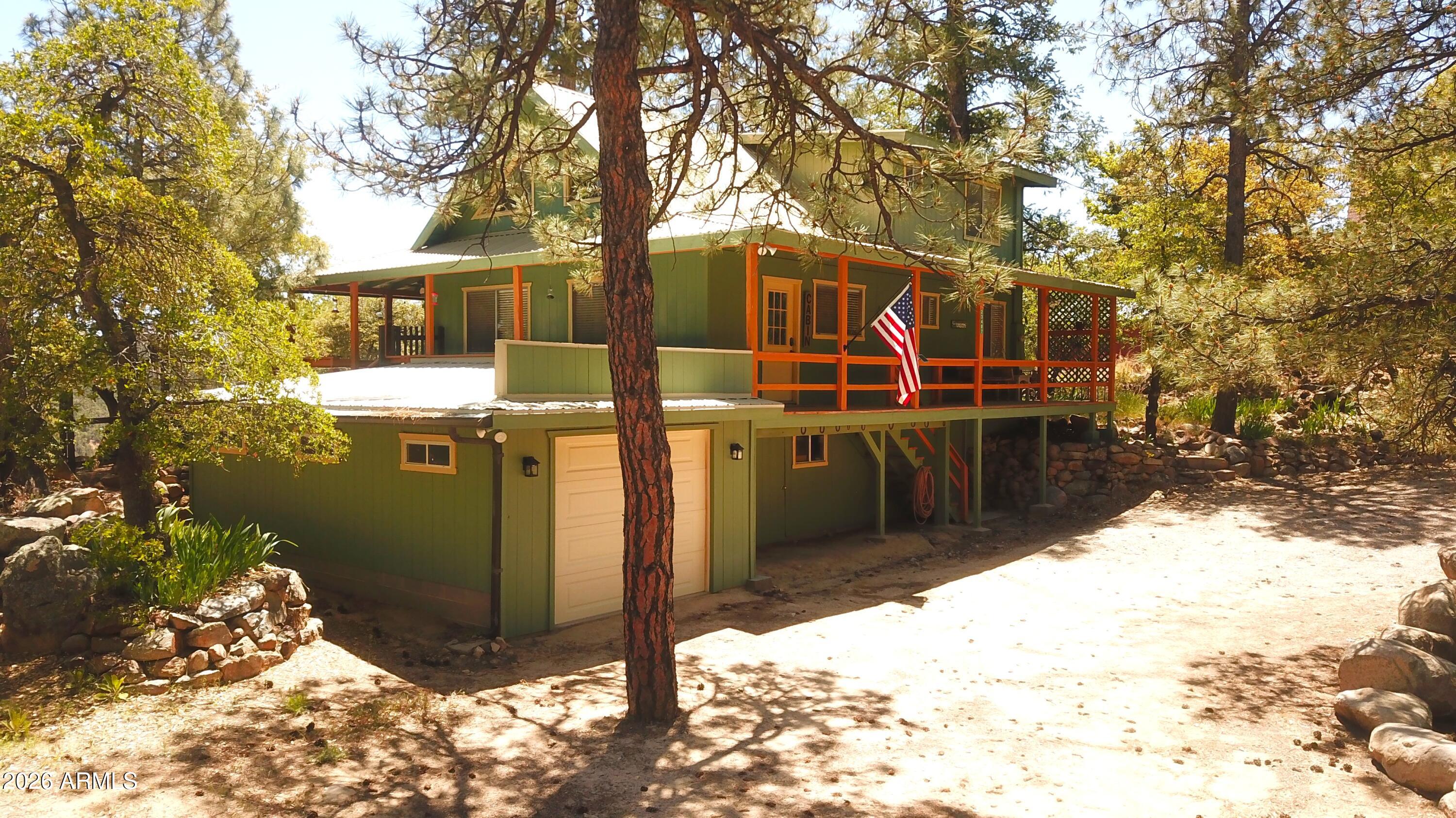 23487 Manzanita Road Crown King, AZ 86343 - Photo 28 of 45 a view of a house with a yard