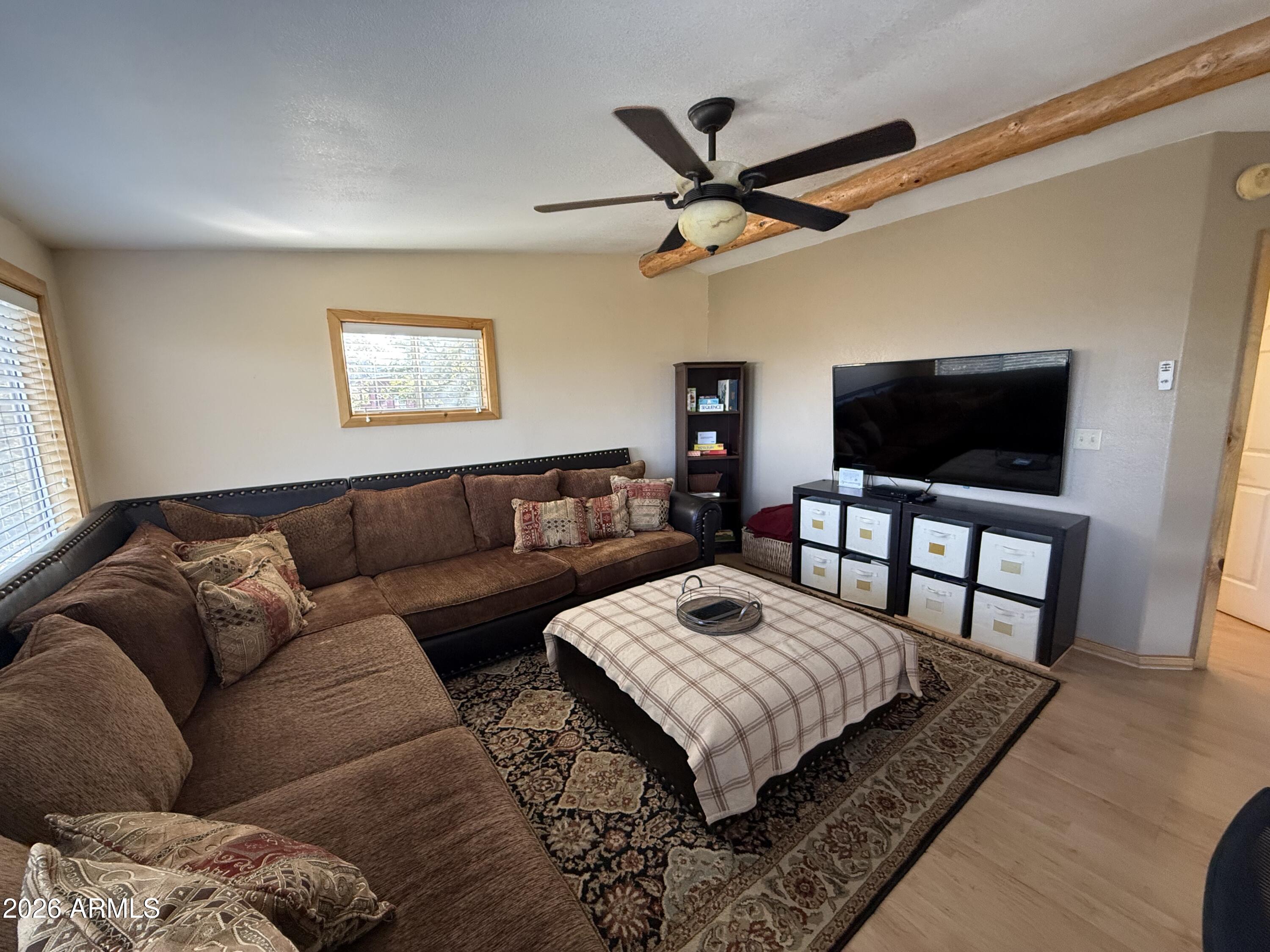 23487 Manzanita Road Crown King, AZ 86343 - Photo 36 of 41 a living room with furniture and a flat screen tv