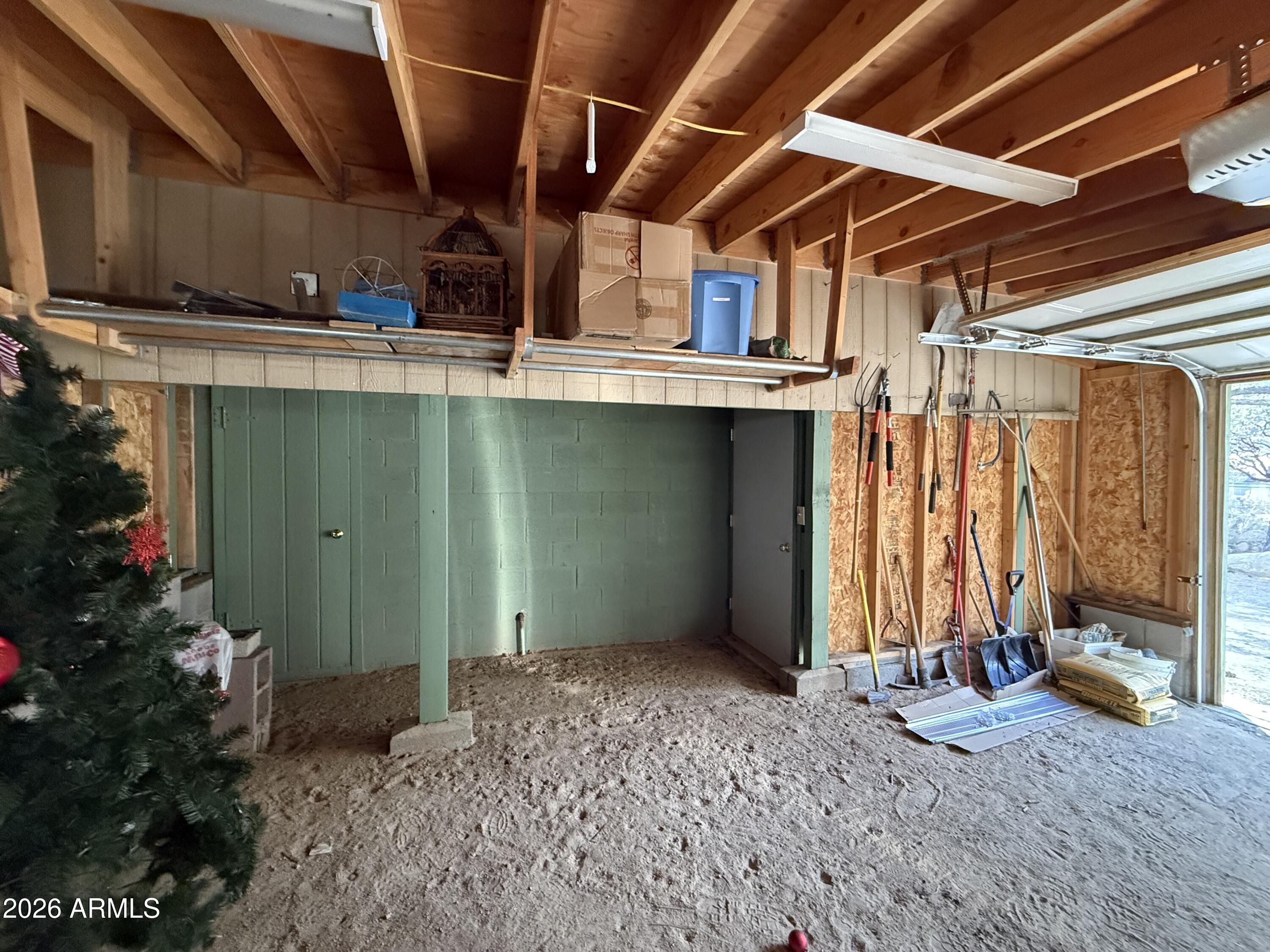 23487 Manzanita Road Crown King, AZ 86343 - Photo 42 of 45 a view of a room with wooden walls