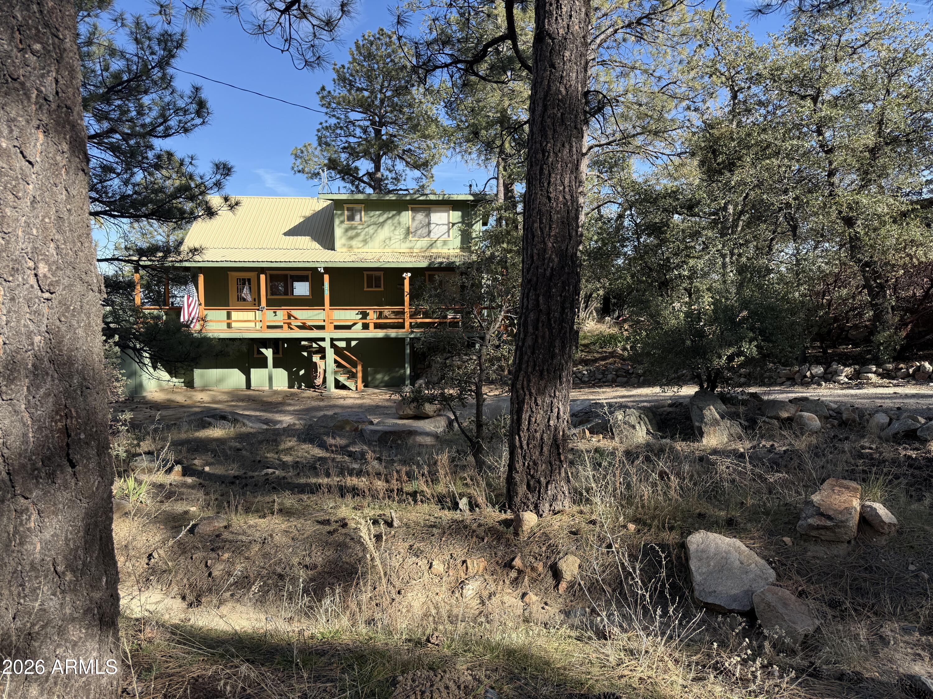 23487 Manzanita Road Crown King, AZ 86343 - Photo 43 of 45 a view of a house with a yard