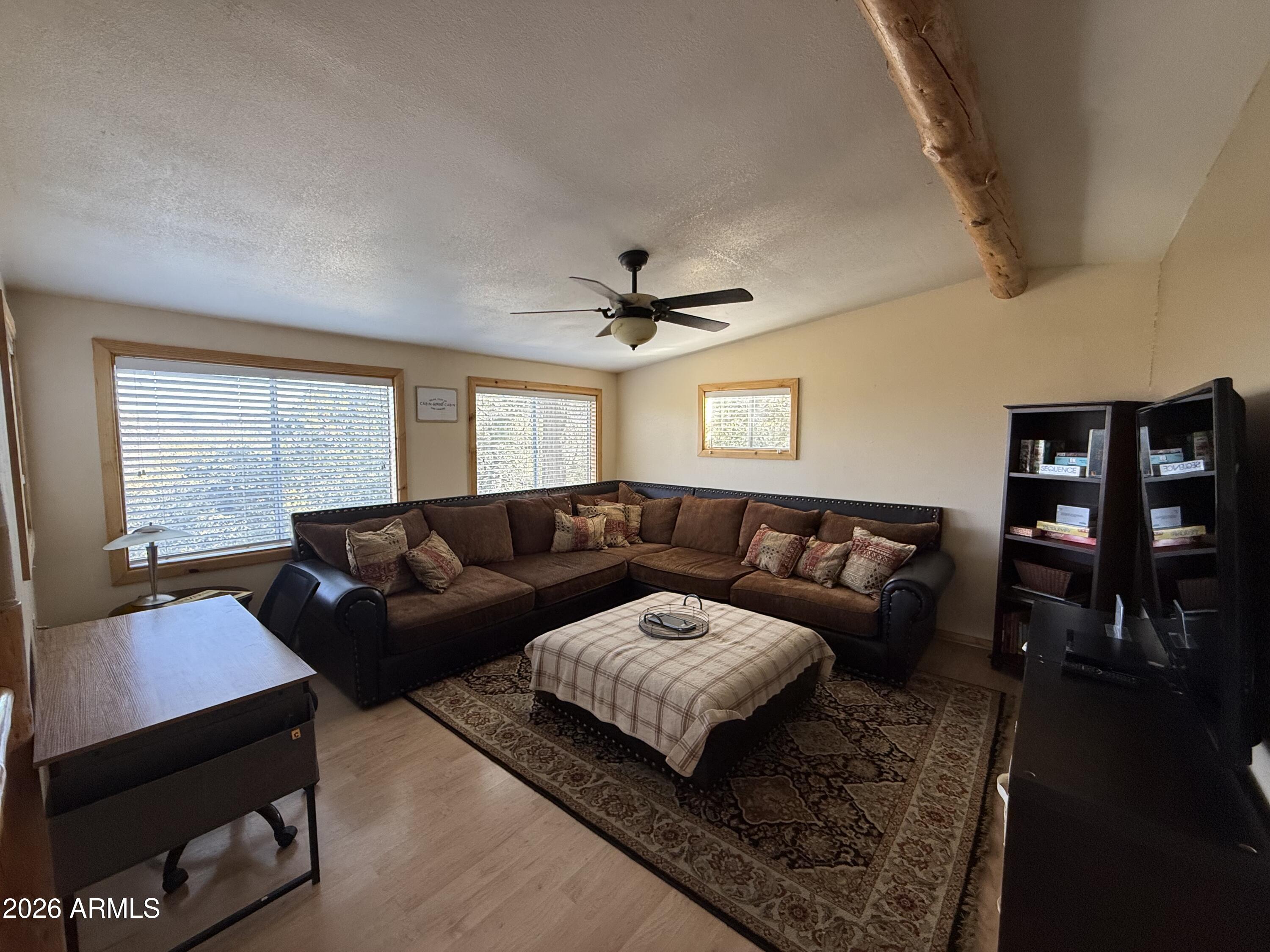 23487 Manzanita Road Crown King, AZ 86343 - Photo 5 of 41 a living room with furniture and a large window