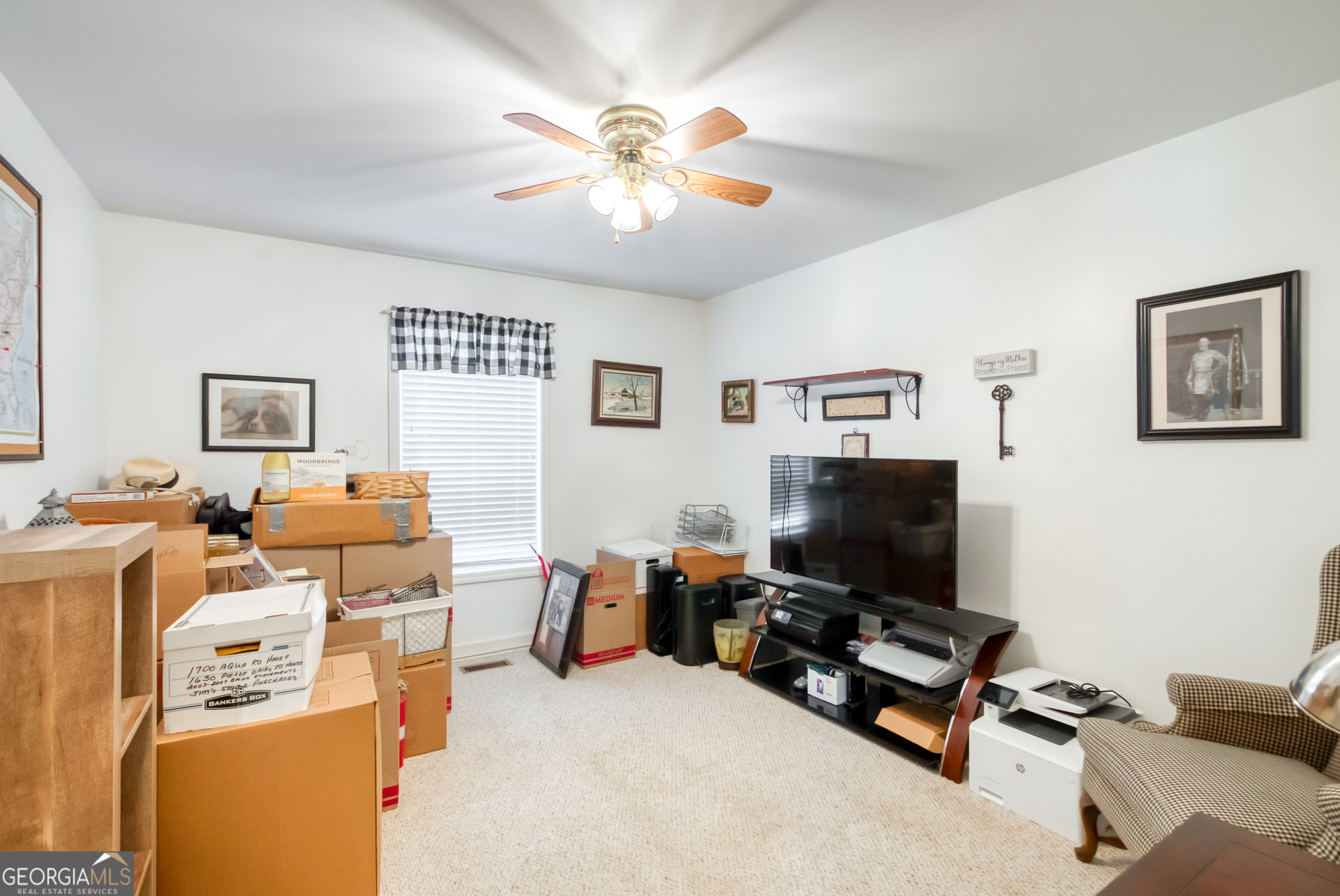 1650 Pierce Dairy Road Madison, GA 30650 - Photo 25 of 85 a living room with furniture and a flat screen tv
