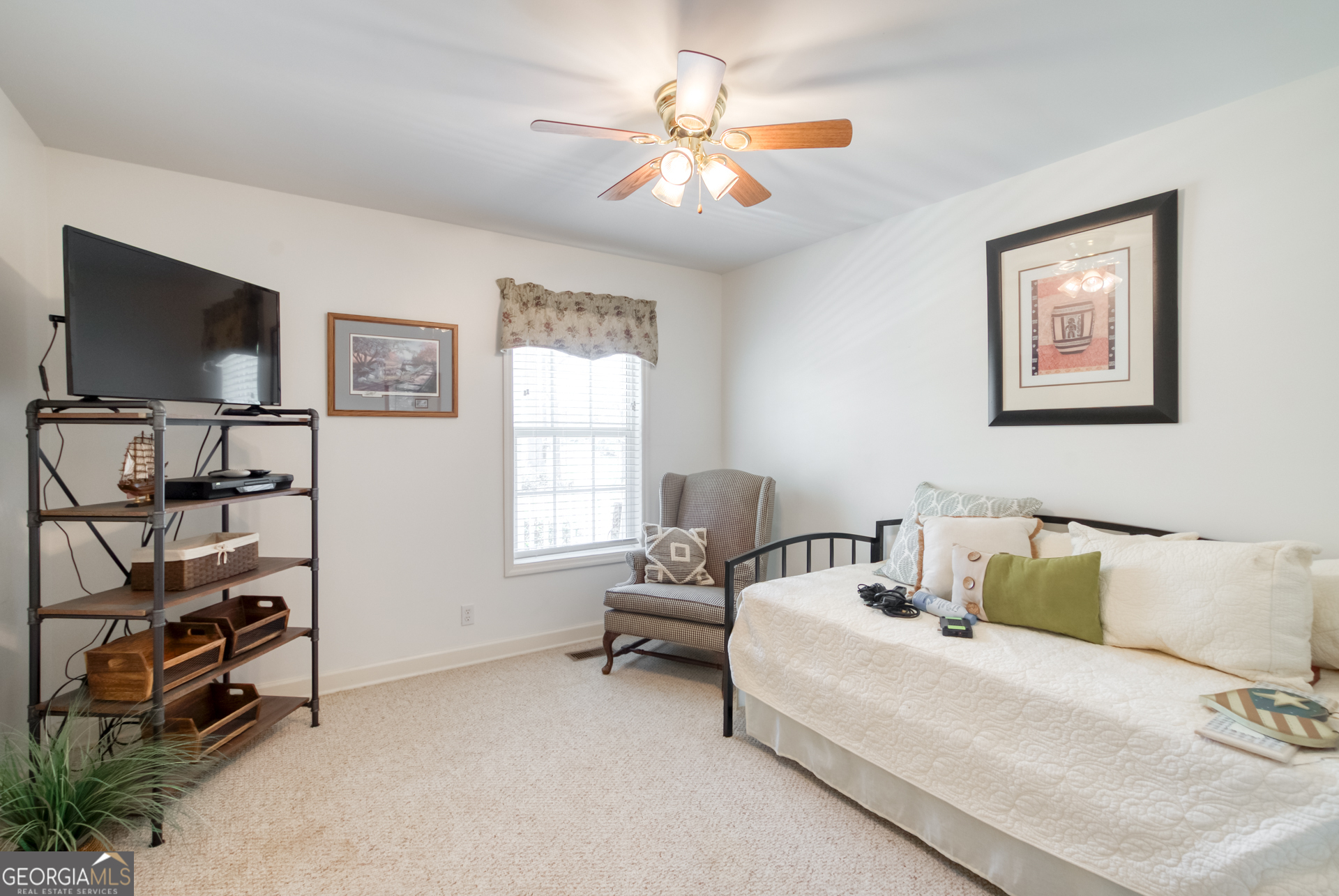 1650 Pierce Dairy Road Madison, GA 30650 - Photo 26 of 85 a bedroom with a bed and a flat screen tv