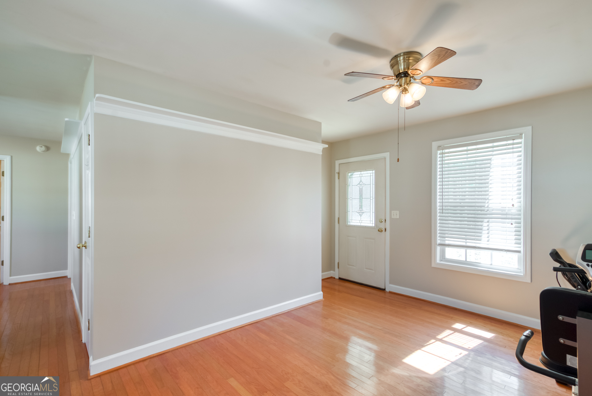 1650 Pierce Dairy Road Madison, GA 30650 - Photo 45 of 85 a view of a livingroom with a window and a ceiling fan