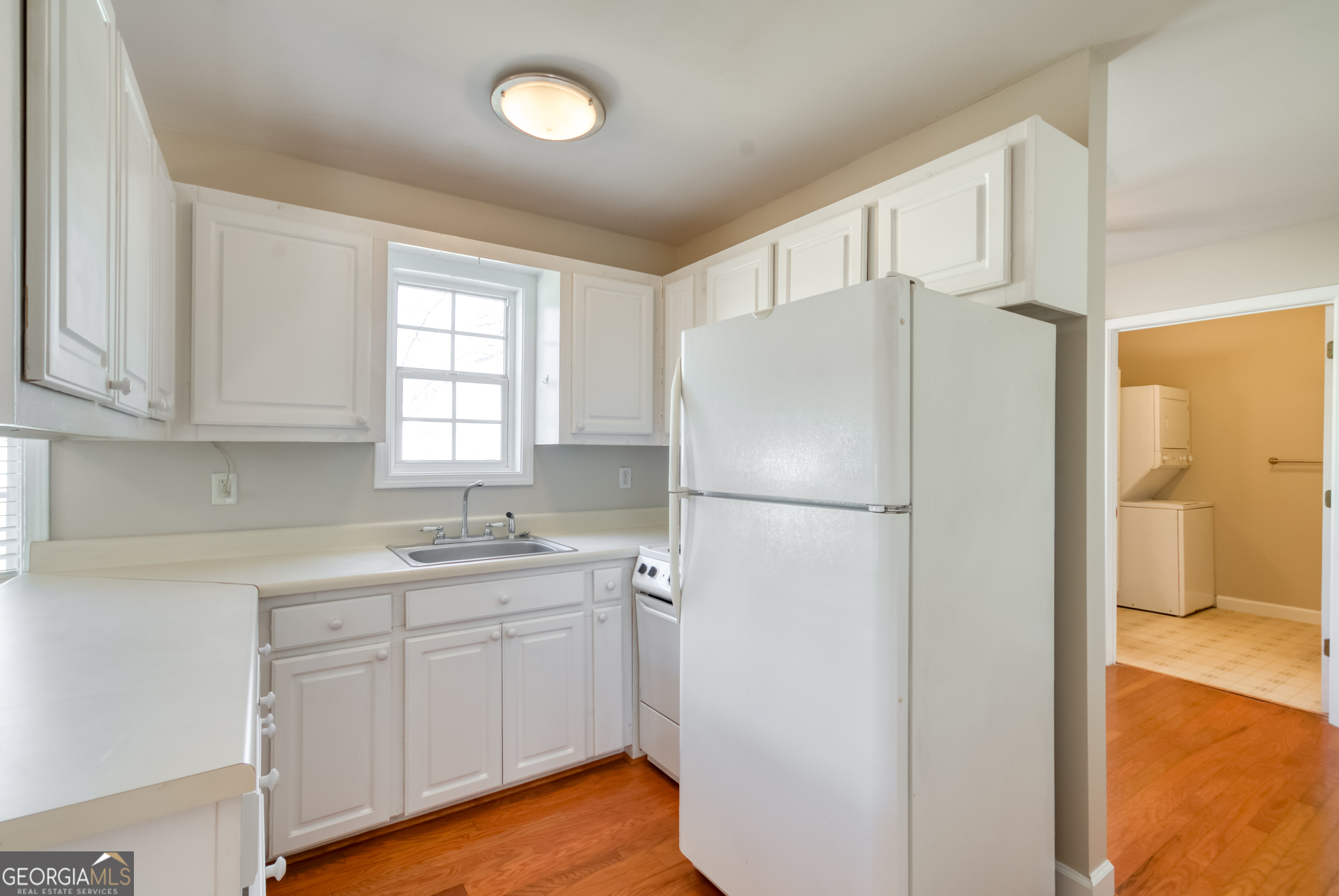 1650 Pierce Dairy Road Madison, GA 30650 - Photo 47 of 85 a white refrigerator freezer sitting inside of a kitchen