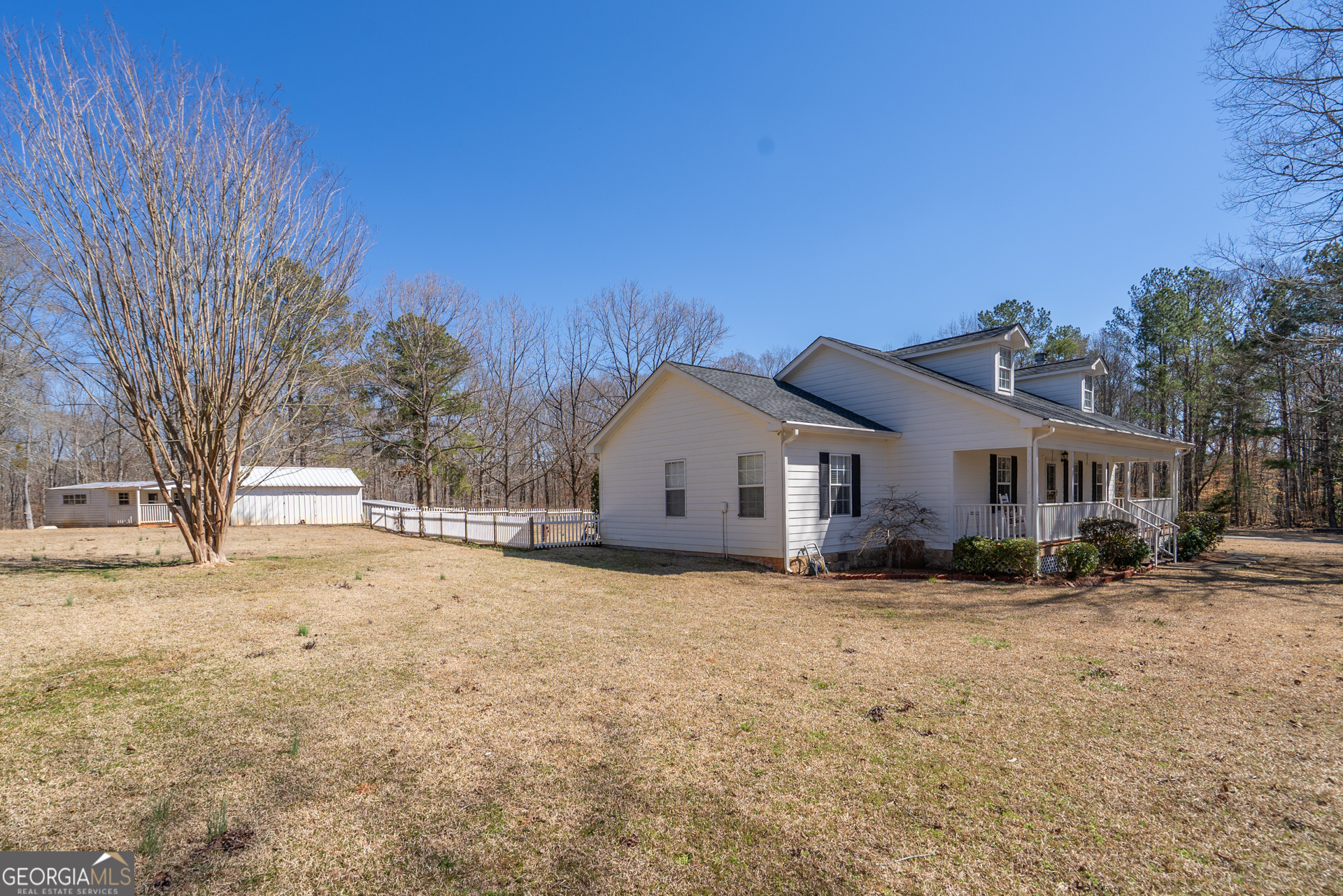 1650 Pierce Dairy Road Madison, GA 30650 - Photo 5 of 85 a view of a house with a yard covered in snow