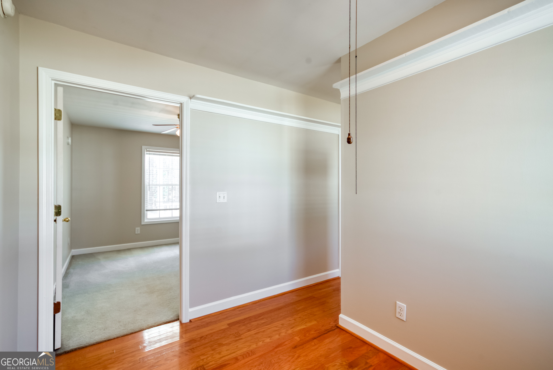 1650 Pierce Dairy Road Madison, GA 30650 - Photo 51 of 85 a view of an empty room with wooden floor