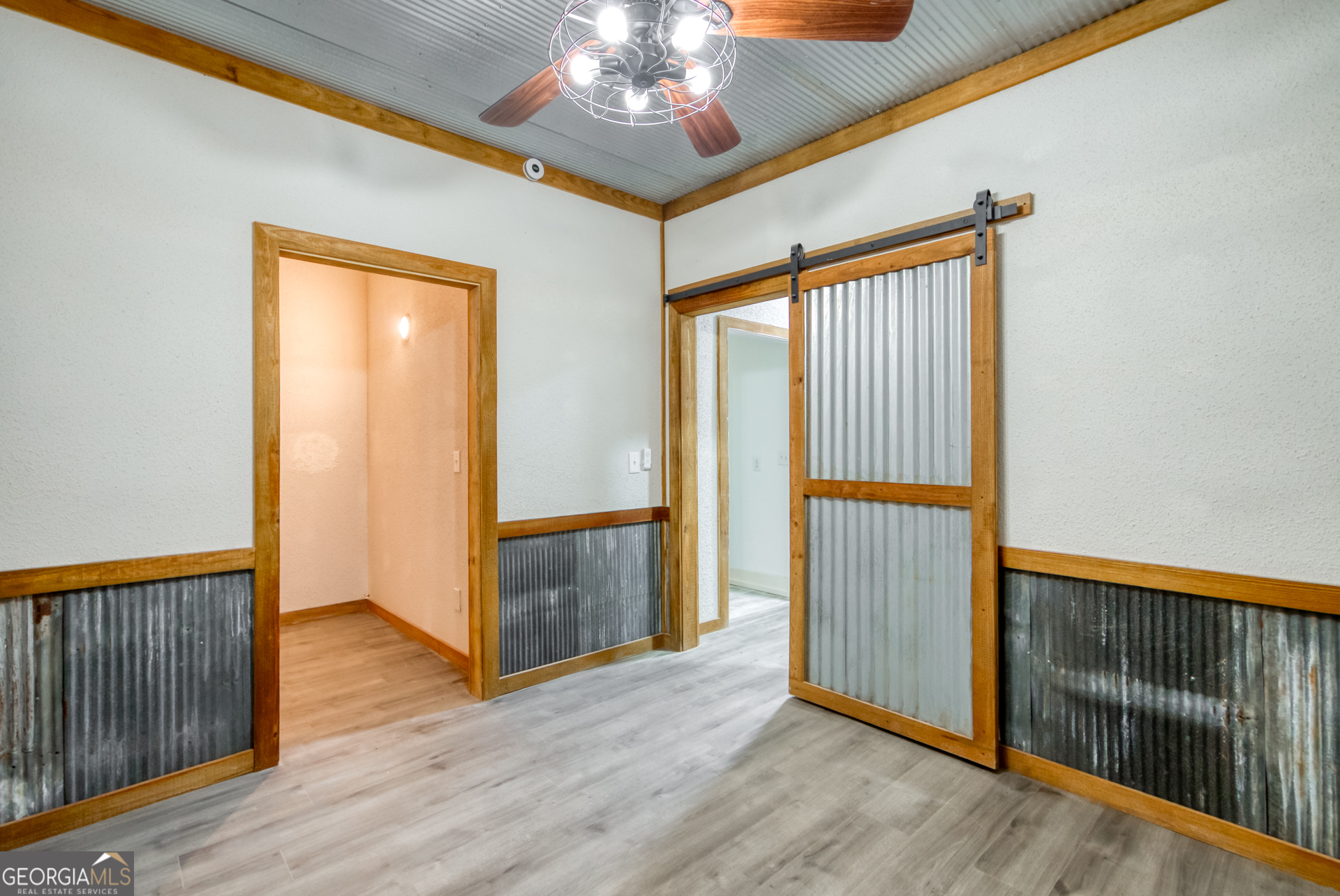 1650 Pierce Dairy Road Madison, GA 30650 - Photo 71 of 85 a view of a hallway with wooden floor and staircase