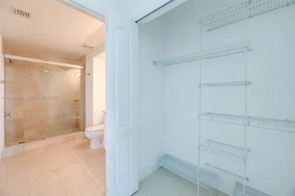 a bathroom with a shower and a toilet