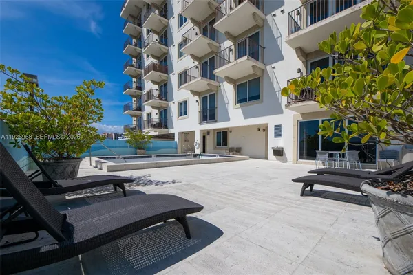 a view of a building with sitting area