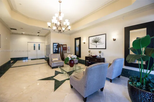 a living room with furniture chandelier and a chandelier