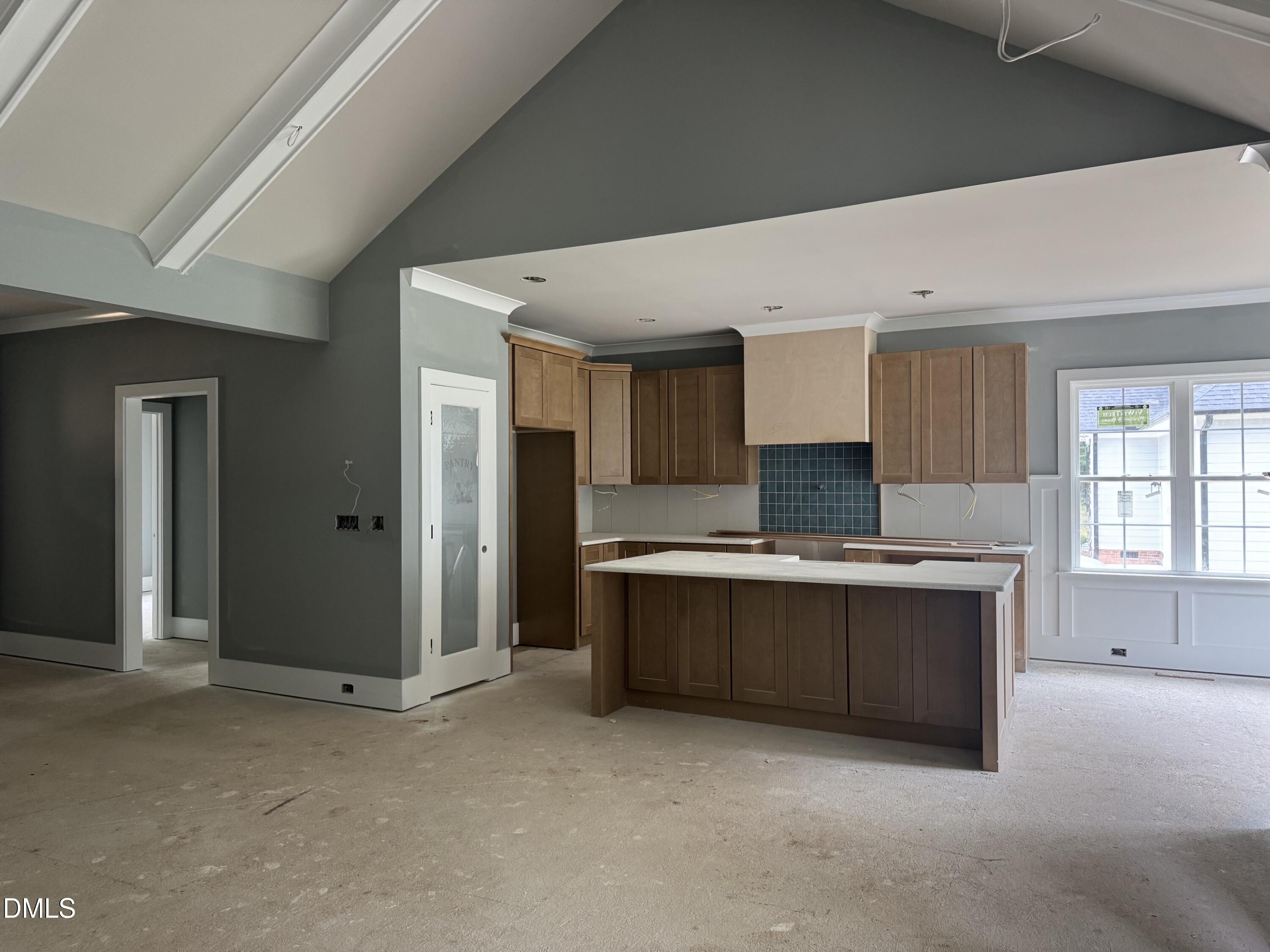935 Lynch Road Selma, NC 27576 - Photo 2 of 21 a large kitchen with stainless steel appliances granite countertop a stove and a refrigerator