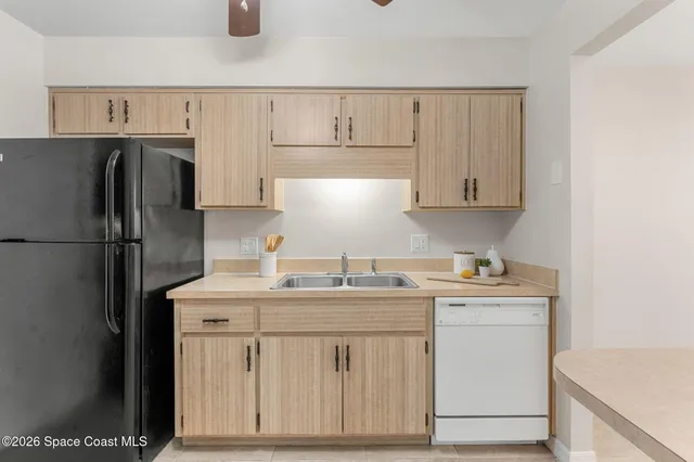 a kitchen with stainless steel appliances a stove a refrigerator and a microwave