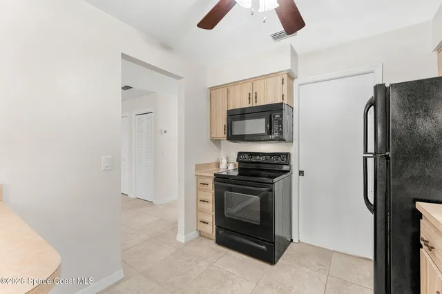 a kitchen with sink cabinets and window