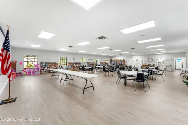 a front view of house with yard and outdoor seating