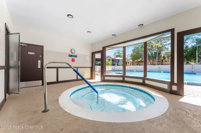 an aerial view of a house with a yard and garden