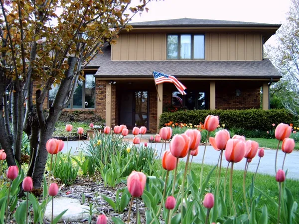 a front view of house with an outdoor space and seating