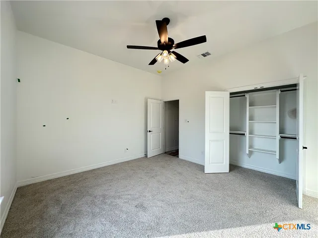 a view of an empty room with a fireplace