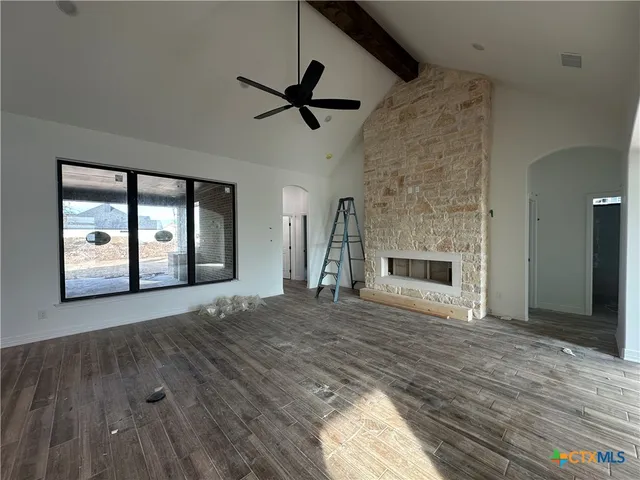 a view of livingroom with hardwood floor and kitchen