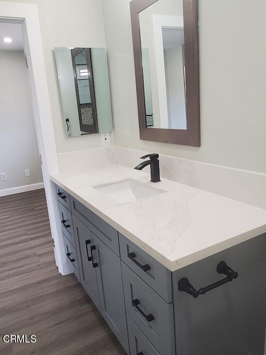 410 Bluebell Place Oxnard, CA 93036 - Photo 14 of 20 a bathroom with a double vanity sink and mirror