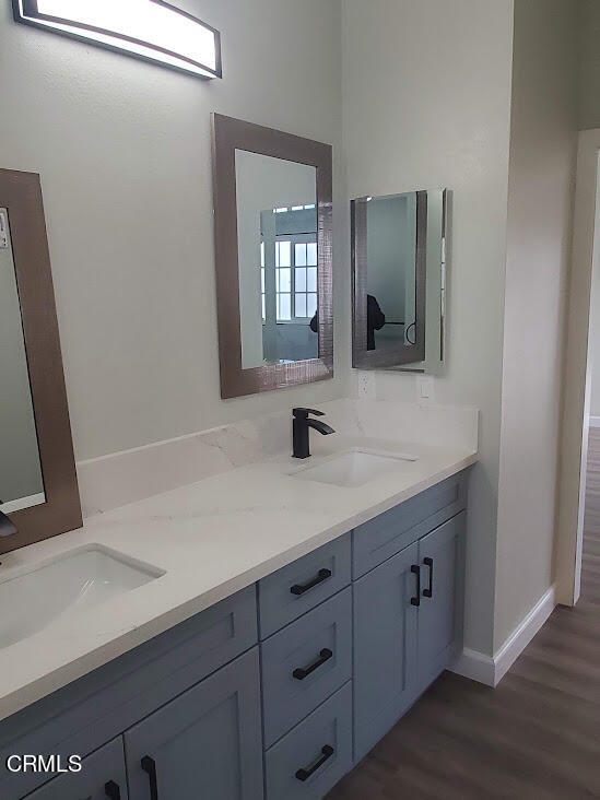 410 Bluebell Place Oxnard, CA 93036 - Photo 15 of 20 a bathroom with a sink and a mirror