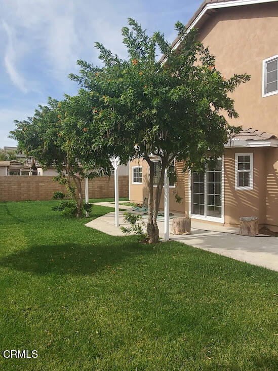 410 Bluebell Place Oxnard, CA 93036 - Photo 18 of 20 a view of a house with a yard