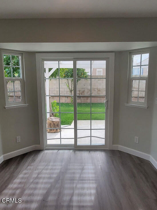 410 Bluebell Place Oxnard, CA 93036 - Photo 3 of 20 a view of an empty room with wooden floor and a window