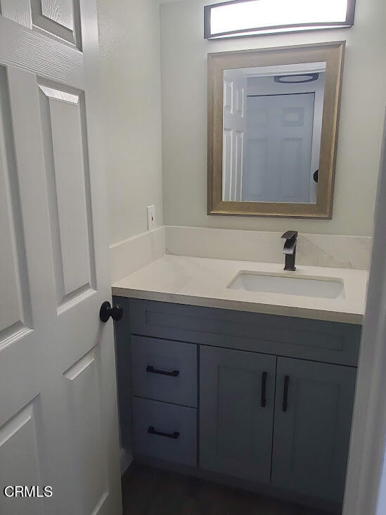 410 Bluebell Place Oxnard, CA 93036 - Photo 7 of 20 a bathroom with a sink a vanity and a mirror