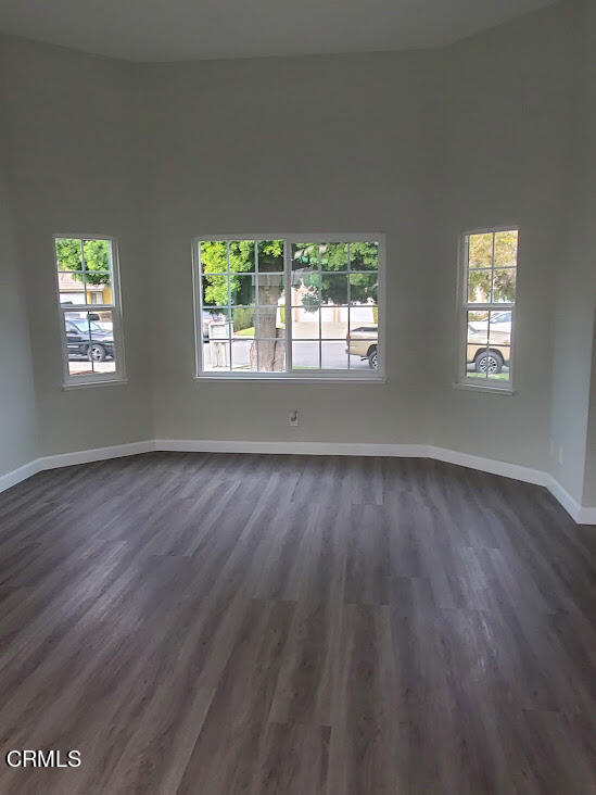 410 Bluebell Place Oxnard, CA 93036 - Photo 8 of 20 a view of an empty room with wooden floor and a window