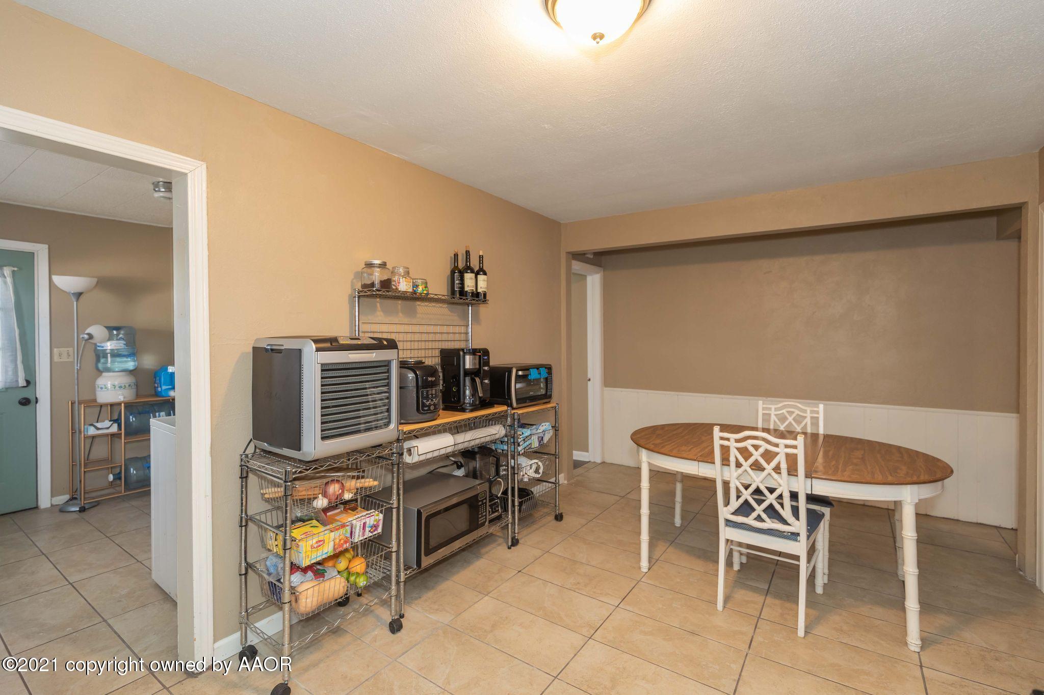 3609 South Taylor Street Amarillo, TX 79110 - Photo 10 of 26 a dining room with furniture and natural light