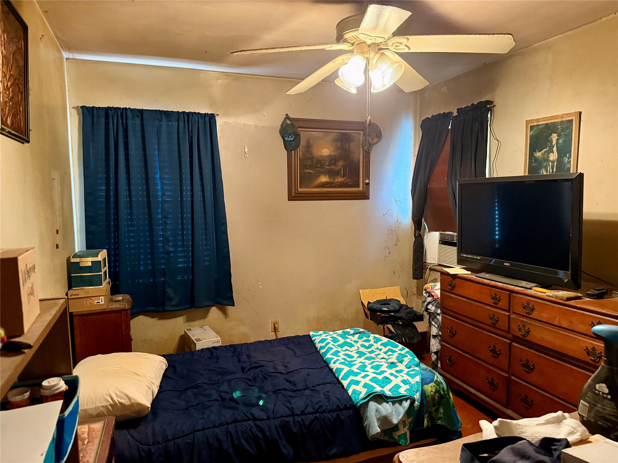 4725 Carleen Road Houston, TX 77092 - Photo 9 of 14 a bedroom with a bed and a flat screen tv