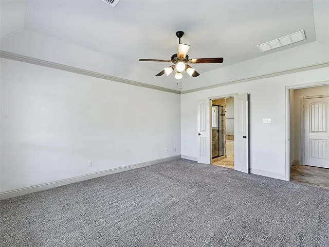 a view of an empty room with a bathroom