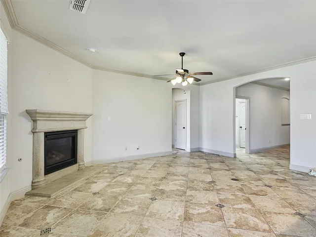 a view of an empty room with a fireplace