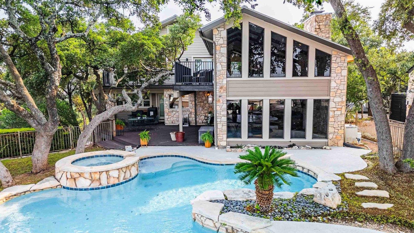 a front view of a house with sitting area