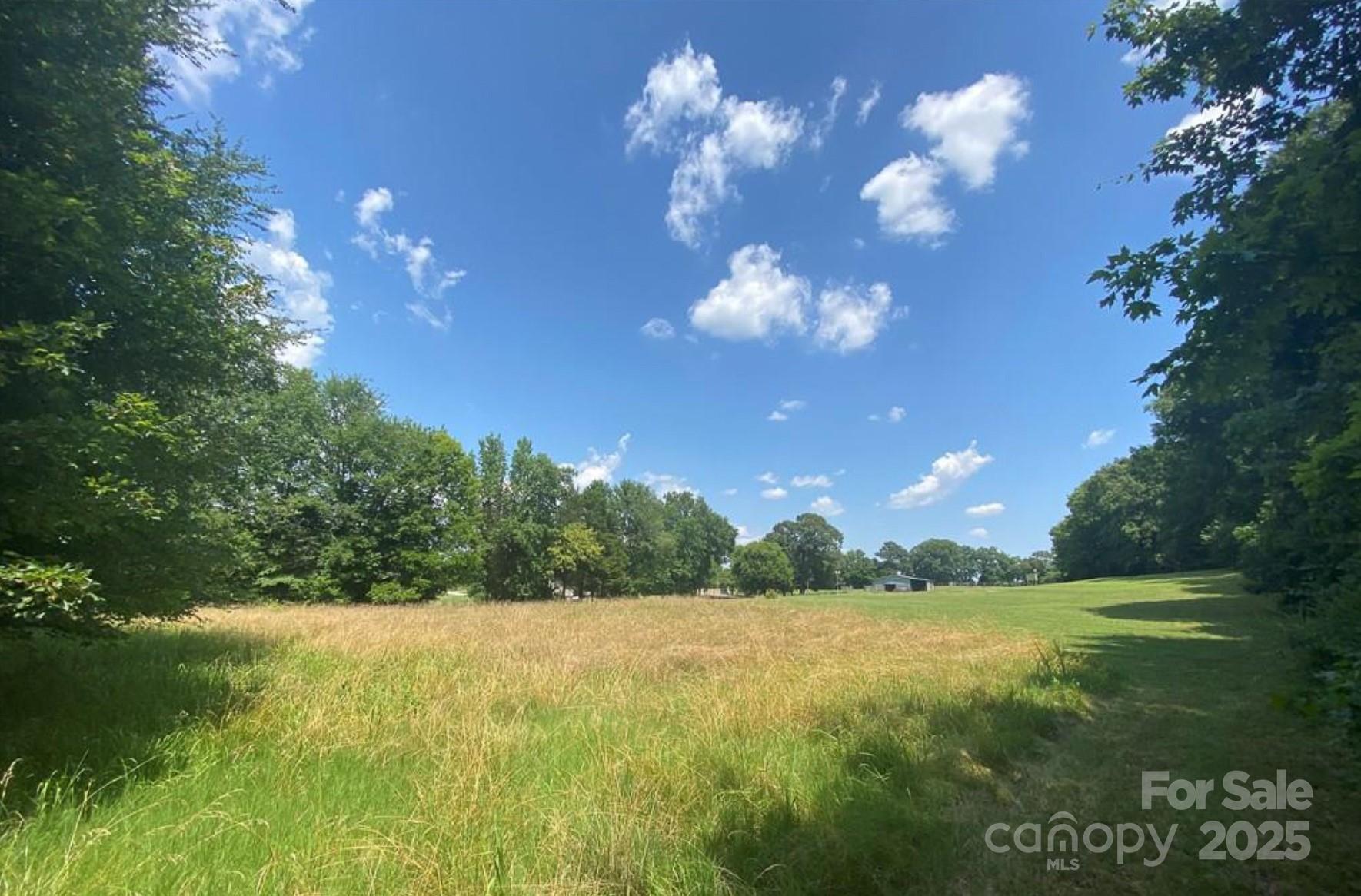 7501 Ruben Linker Road Northwest Concord, NC 28027 - Photo 1 of 6 a view of a yard with a fountain