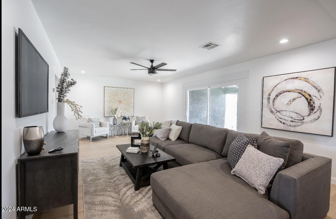 1731 East Verde Lane Phoenix, AZ 85016 - Photo 20 of 26 a living room with furniture and a flat screen tv