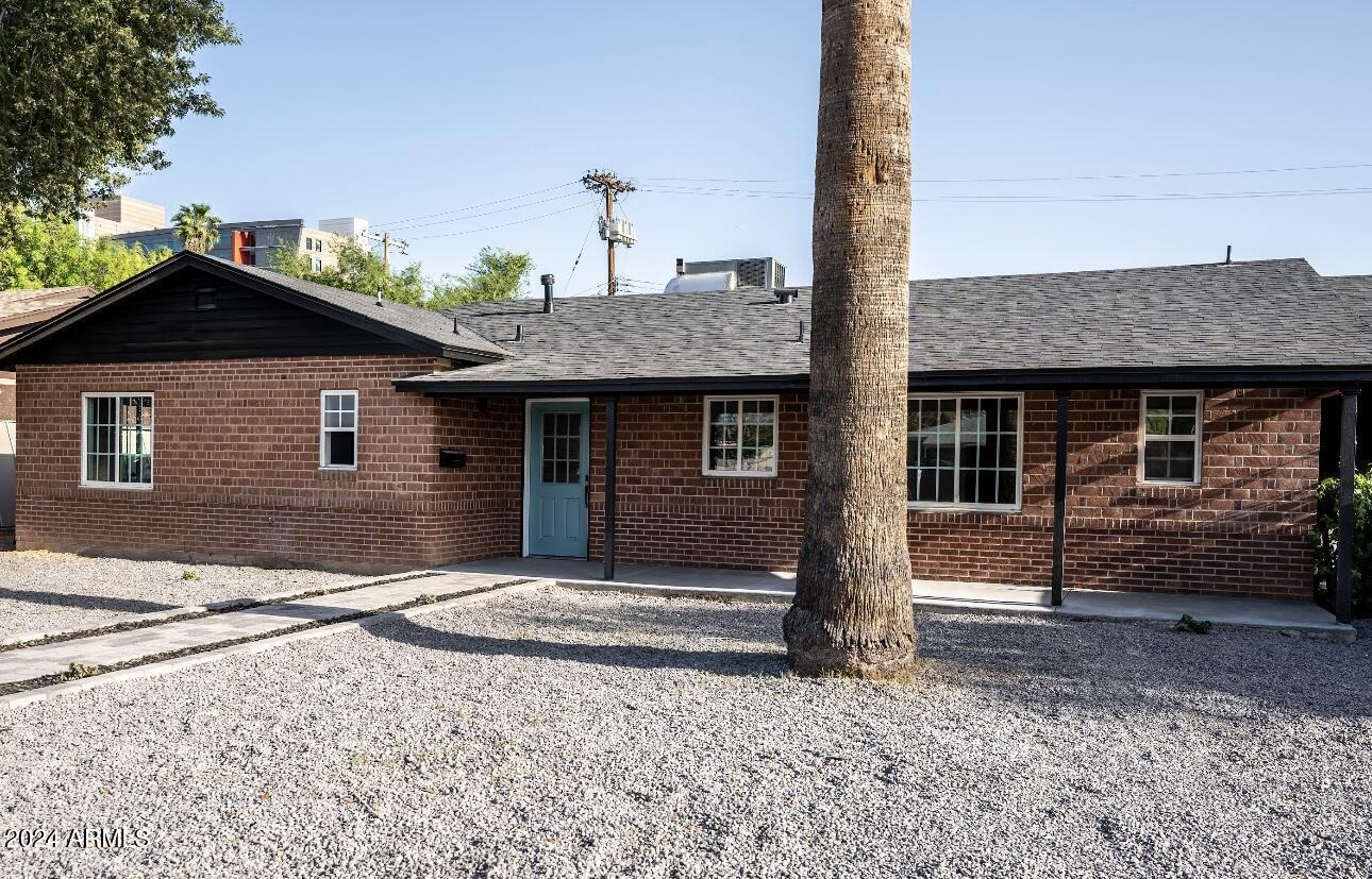 1731 East Verde Lane Phoenix, AZ 85016 - Photo 2 of 26 a front view of a house with garden