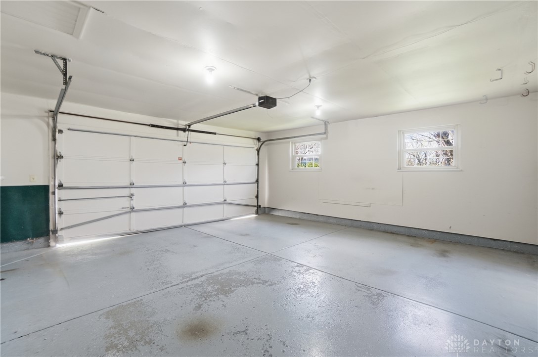 9964 Hummingbird Way Dayton, OH 45458 - Photo 27 of 57 This spacious garage offers ample storage and features a smooth concrete floor.