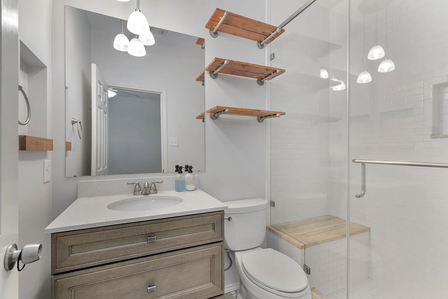 11970 Jollyville Road, Unit 202 Austin, TX 78759 - Photo 13 of 25 A well-appointed bathroom features a modern vanity with a bright white sink, offering both style and practicality.