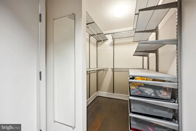a view of storage and utility room with racks on the wall