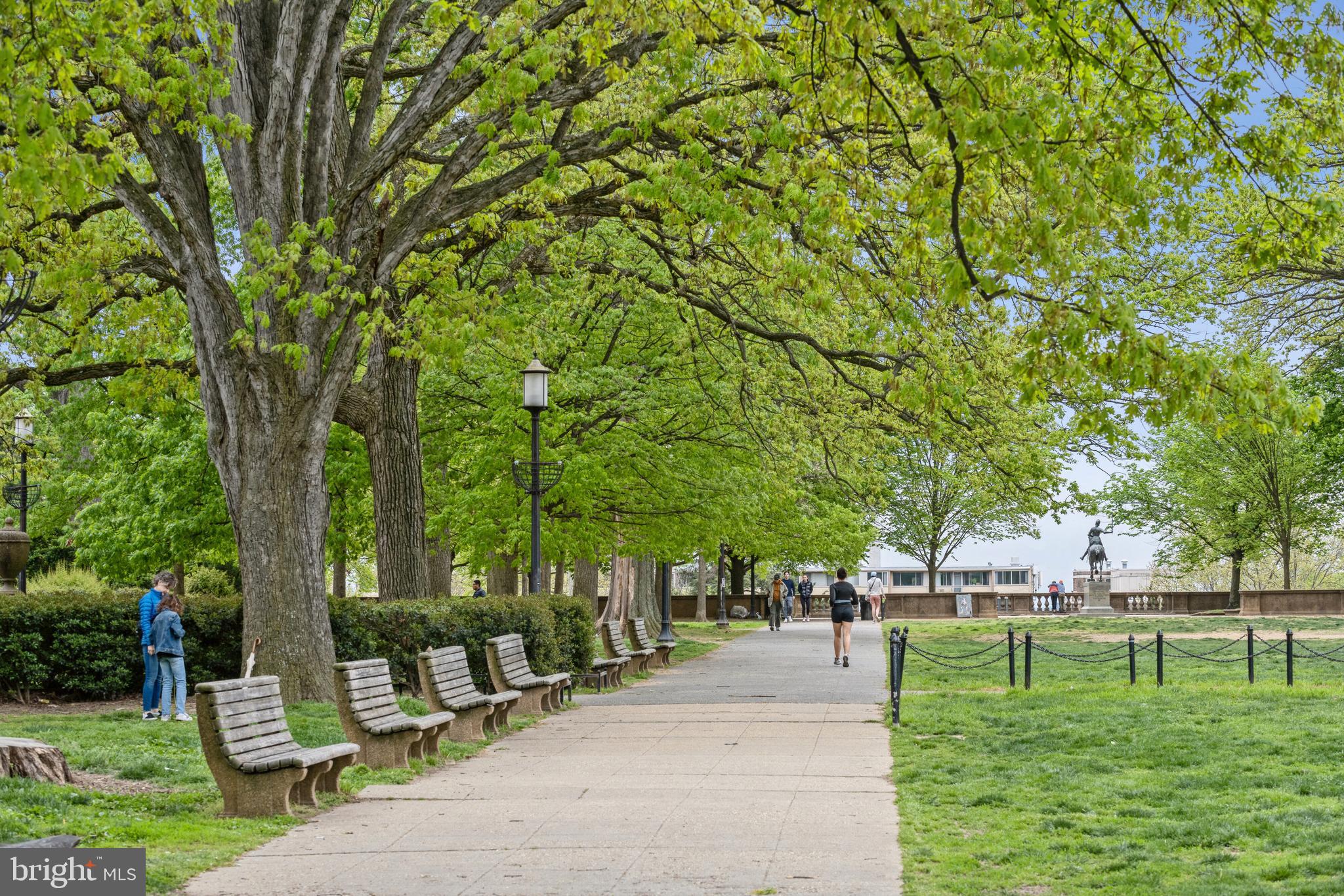 1700 Kalorama Road Northwest, Unit 207 Washington, DC 20009 - Photo 24 of 27 a backyard of a house with lots of green space and fountain