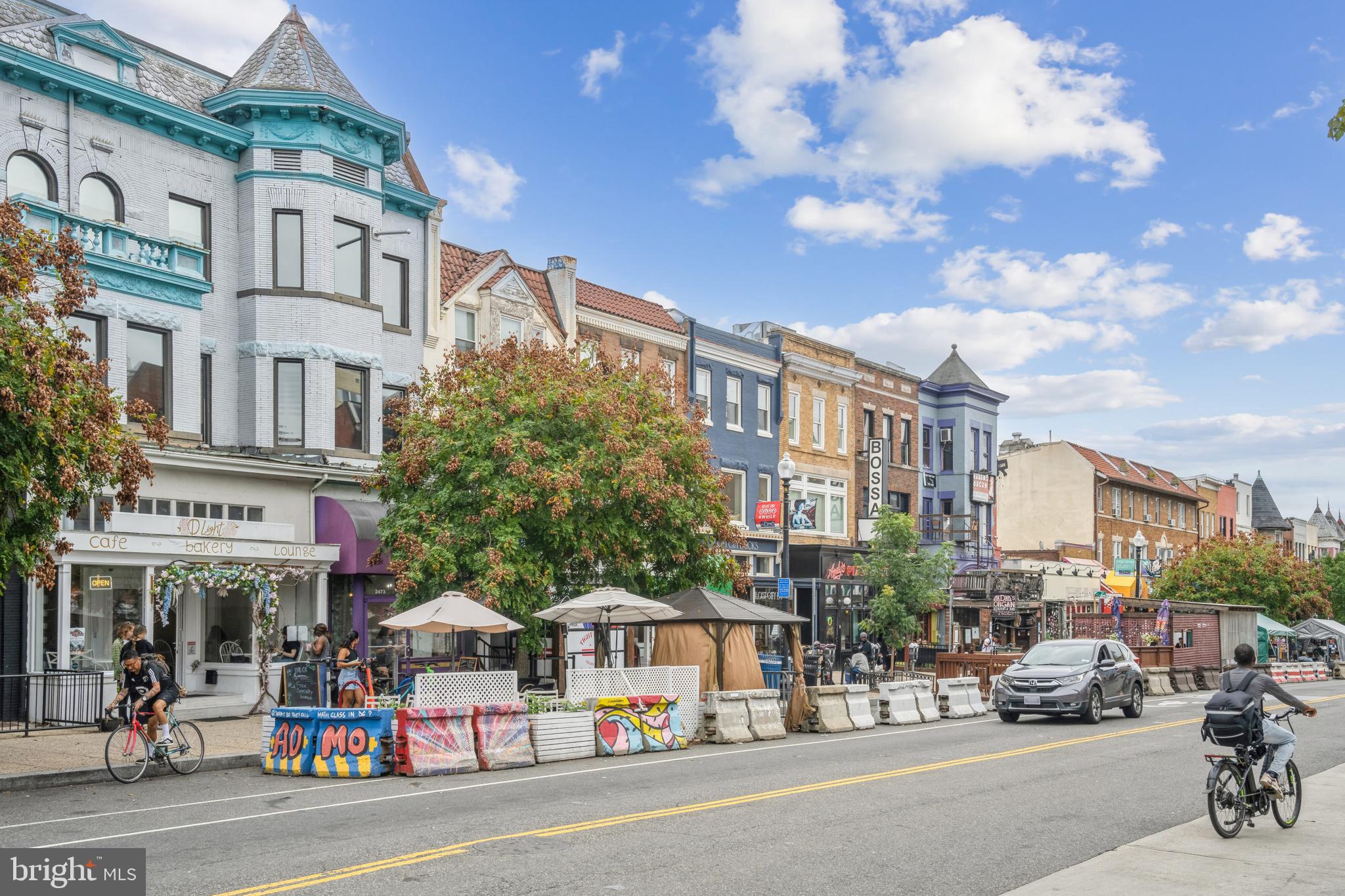 1700 Kalorama Road Northwest, Unit 207 Washington, DC 20009 - Photo 25 of 27 a city street lined with buildings and cars