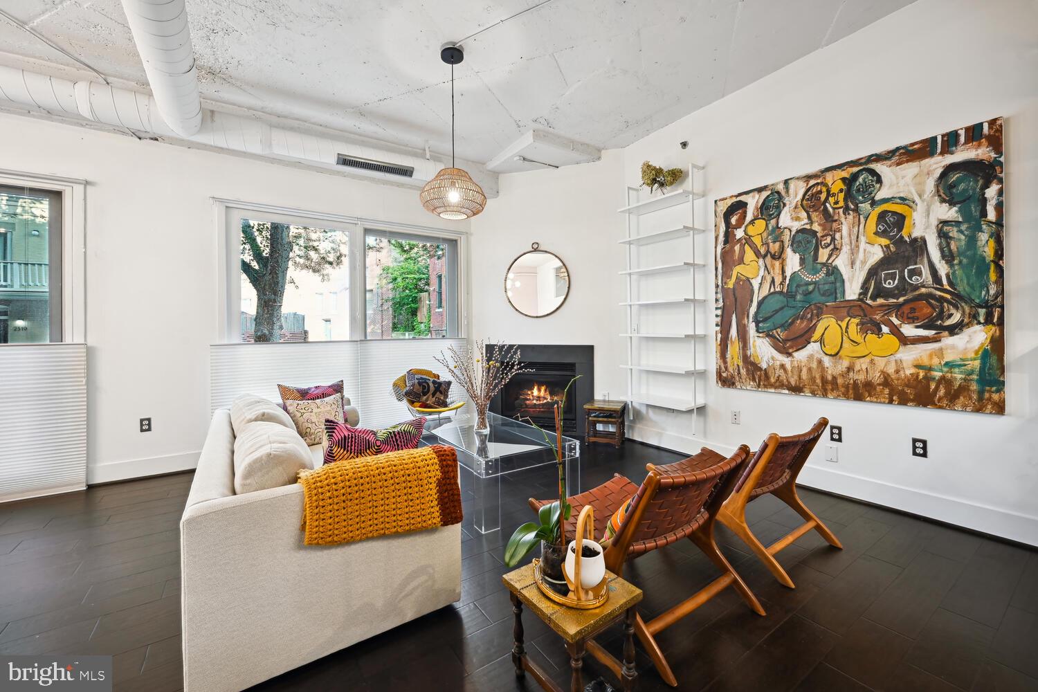 1700 Kalorama Road Northwest, Unit 207 Washington, DC 20009 - Photo 3 of 27 a living room with fireplace furniture and a wooden floor