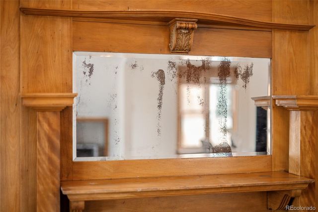 a view of a livingroom with furniture and hardwood floor