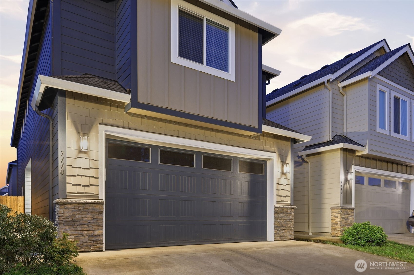 7110 South 13th Street Ridgefield, WA 98642 - Photo 2 of 28 a front view of a house with a yard