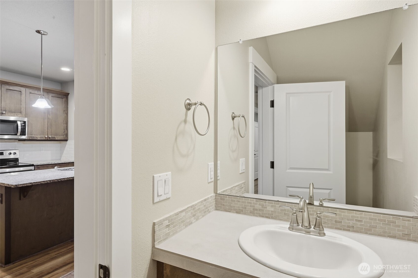 7110 South 13th Street Ridgefield, WA 98642 - Photo 10 of 28 a bathroom with a sink a toilet and shower