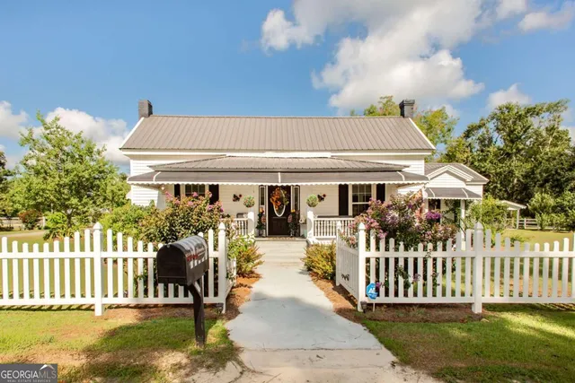 a front view of a house with a porch